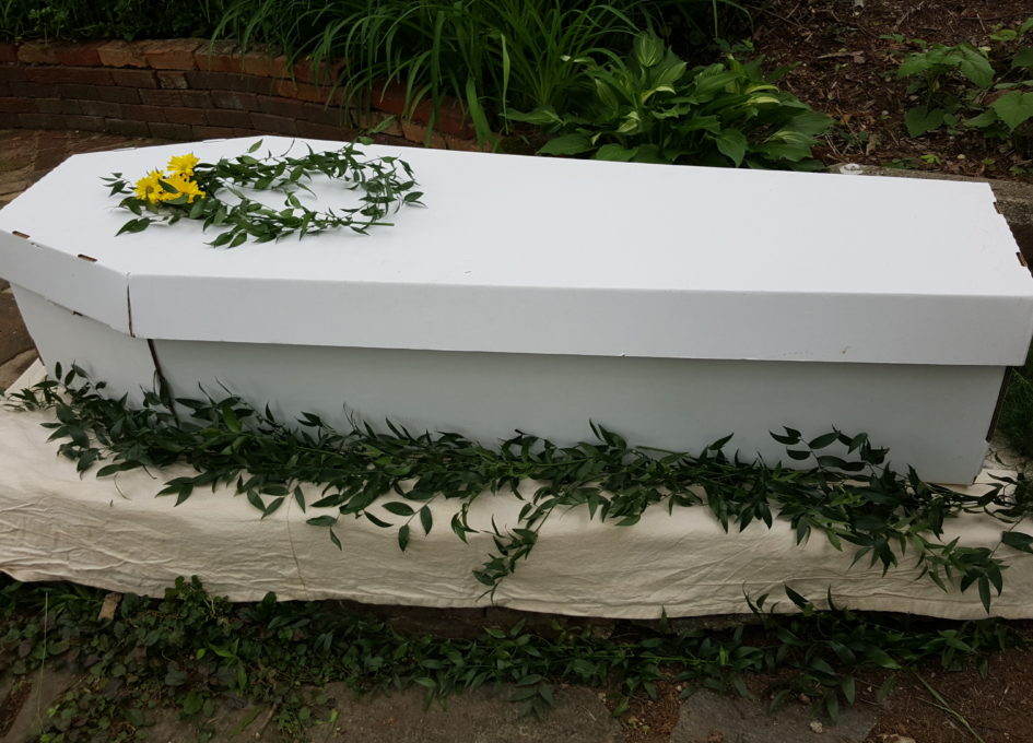 cardboard coffin image from https://mourningdovestudio.com/